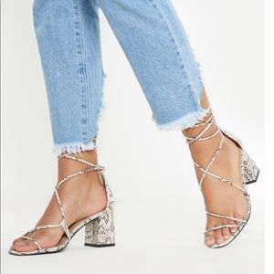 Snake print, strappy, mini heel.